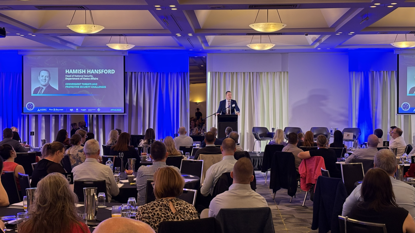 Hamish Hansford addressing PSG 2025 at the Hyatt Hotel Canberra